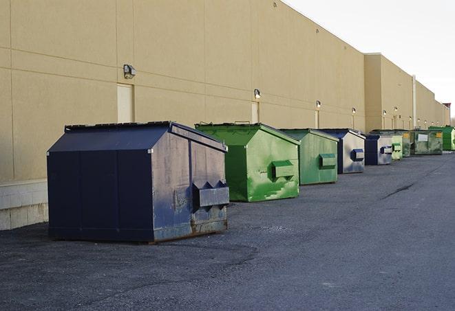 metal waste containers sit at a busy construction site in Branch